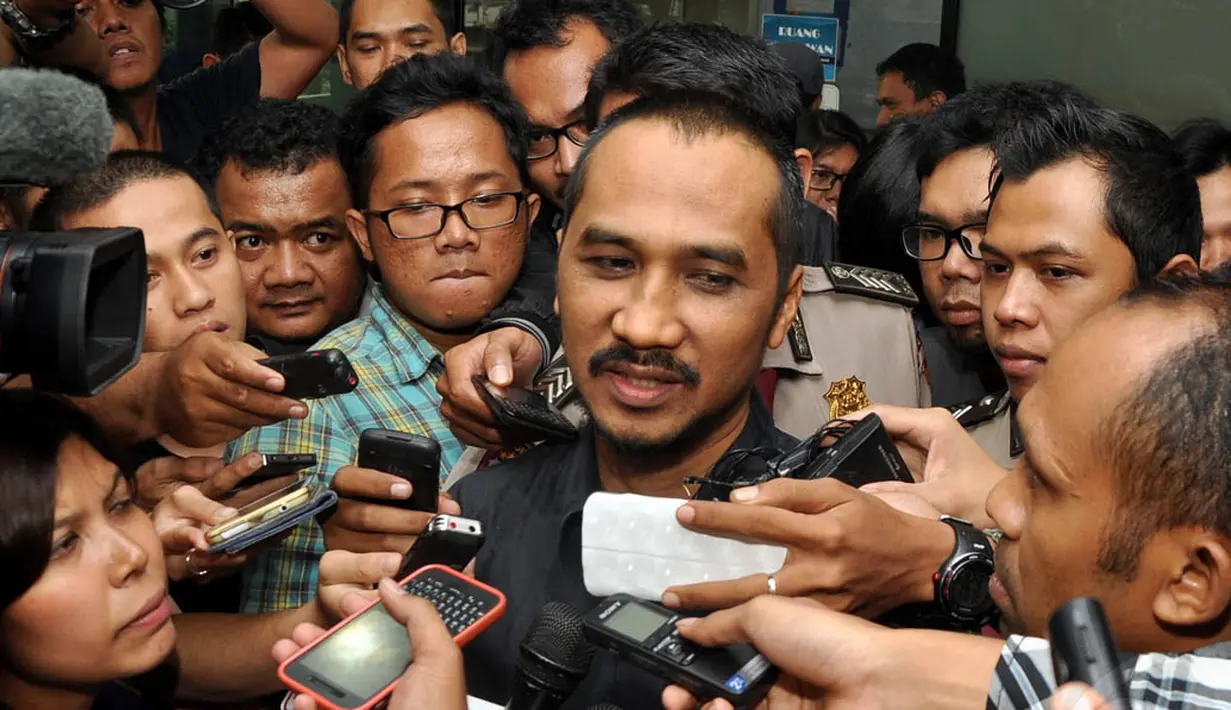Ketua Komisi Pemberantasan Korupsi (KPK) Abraham Samad saat menjawab pertanyaan wartawan di kantornya, Jakarta, (22/10/14). (Liputan6.com/Miftahul Hayat) 
