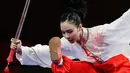 Atlet Wushu Indonesia, Lindswell Kwok saat beraksi pada Asian Games  di JIExpo, Jakarta, Senin, (20/8). Lindswell Kwok berhasil menyumbang emas kedua untuk Indonesia di Asian Games 2018. (AP Photo/Aaron Favila)