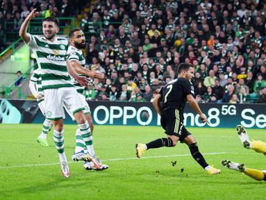 Real Madrid sukses melumat tuan rumah Celtic tiga gol tanpa balas pada laga perdana Grup F Liga Champions yang digelar di Celtic Park, Glasgow, Selasa (6/9/2022). (AFP/Andy Buchanan)