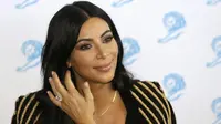 Kim Kardashian disebut-sebut bosan melihat pemberitaan Meghan Markle dan Pangeran Harry. Benarkah itu? (Lionel Cironneau / AP photo)