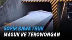 Sang sopir dengan handal mengarahkan truk ke mulut terowongan, meski tak punya celah lebar.