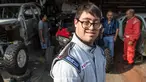 Paralympian Peru, Lucas Barron (25) berada di bengkel mekanik dimana mobilnya sedang dipersiapkan untuk Rally Dakar 2019 di Lima, 18 Desember 2018. Lucas akan menjadi pereli dengan down syndrome pertama dalam sejarah Dakar Rally. (ERNESTO BENAVIDES /AFP)