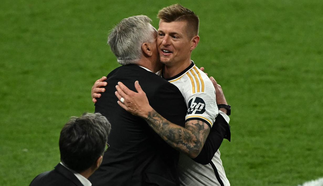 Toni Kroos menutup kariernya sebagai pesepak bola professional secara gemilang. (Ben Stansall/AFP)