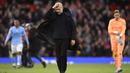 Ekspresi kecewa pelatih Manchester City, Pep Guardiola setelah dikalahkan Manchester United dalam laga Liga Inggris 2022/2023 di Old Trafford Stadium, Manchester (14/1/2023). Sanksi lain yang bisa saja diterima Manchester City adalah berupa degradasi dari Premier League untuk musim depan. (AFP/Oli Scarff)