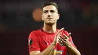 Diogo Dalot - Bek muda asal Portugal yang kini memperkuat AC Milan akan kembali ke Old Trafford. Dalot akan bereuni dengan rekan setimnya di MU sebagai lawan pada laga leg pertama babak 16 besar Liga Europa. (AFP/Oli Scarff)