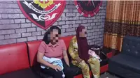 Dua pelaku pembunuhan bocah 5 tahun di Kota Gorontalo saat tiba di Polres Gorontalo Kota