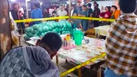 Garis polisi terpasang di lokasi perampokan dan penembakan pedagang pasar induk Pekanbaru.  (Liputan6.com/Istimewa)