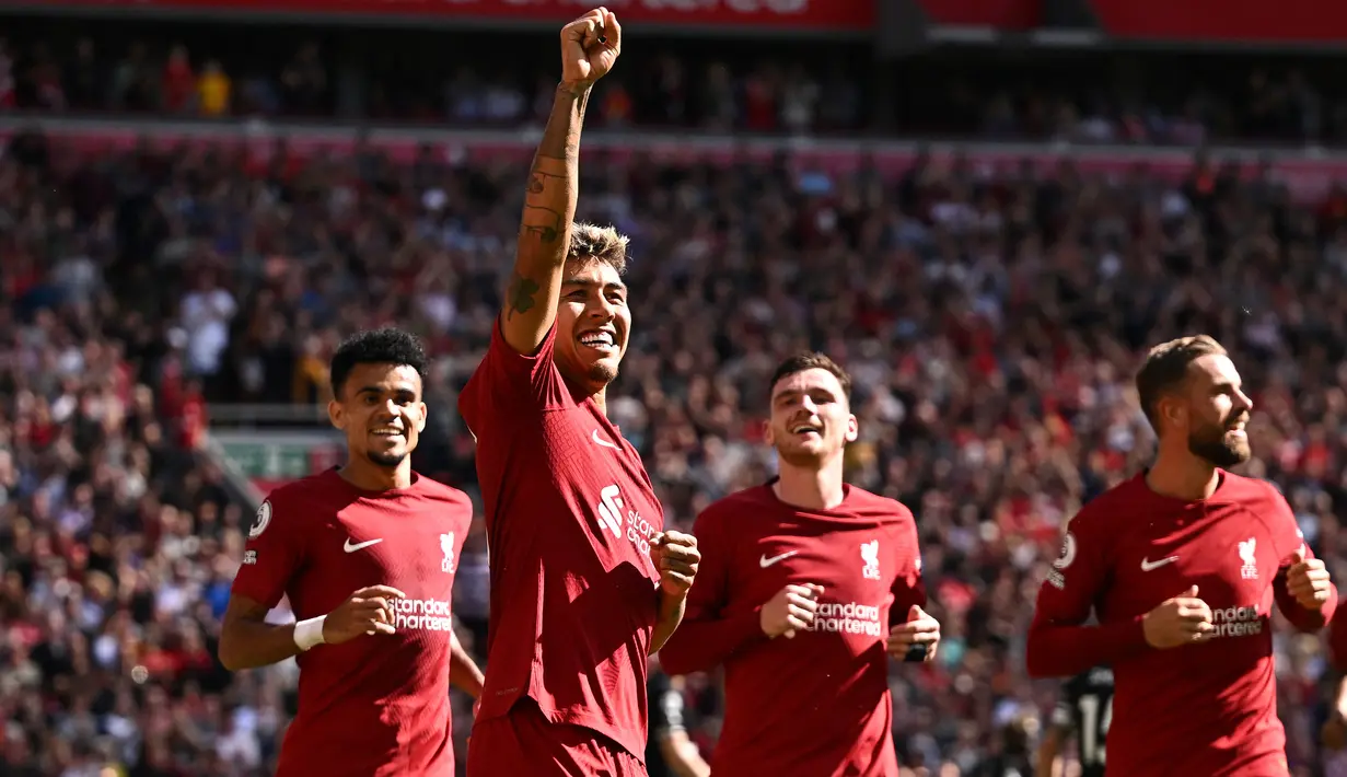 Selebrasi striker Liverpool, Roberto Firmino setelah mencetak gol ke gawang Bournemouth pada laga Liga Inggris 2022/2023 di Anfield Stadium, Liverpool (27/8/2022). Roberto Firmino yang dipastikan meninggalkan Liverpool pada musim depan, menjadi pemain pertama yang mencetak hattrick assist di Liga Inggris pada musim 2022/2023. Momen itu terjadi di pekan ke-4 saat Liverpool menang 9-0 atas Bournemouth. Dua gol juga dicetaknya dalam laga tersebut. (AFP/Oli Scarff)