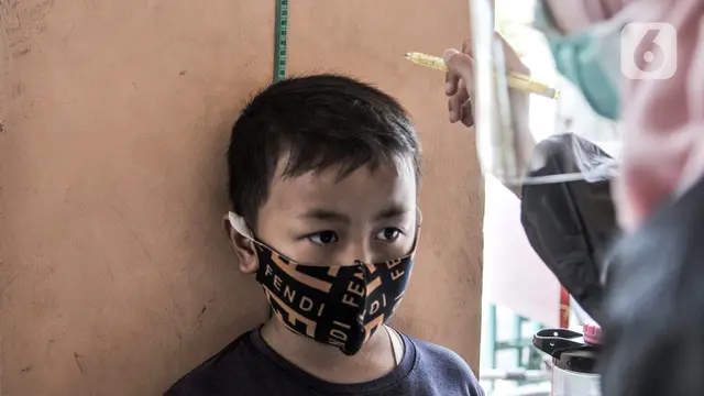 FOTO: Imunisasi Anak Sekolah di Masa Pandemi COVID-19