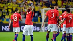 Gelandang Chile, Arturo Vidal melakukan selebrasi usai mencetak gol ke gawang Swedia pada pertandingan persahabatan internasional di Friends Arena, Stockholm, (24/3). Chile menang 2-1 atas Swedia. (Anders Wiklund/TT via AP)