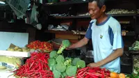 Sularno (50), pedagang sayur di Pasar Grogol, Jakarta Barat.