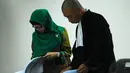 Terdakwah Susi Tur Andayani terbukti melakukan tindak pidana korupsi bersama-sama dengan Akil Mochtar. Senin (19/5/14) (Liputan6.com/Miftahul Hayat)