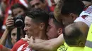 Striker Atletico Madrid, Fernando Torres, merayakan gol ke gawang Eibar pada laga La Liga Spanyol di Stadion Wanda Metropolitano, Madrid, Minggu (20/3/2018). Laga ini merupakan yang terakhir bagi Torres bersama Atletico. (AFP/Gabriel Bouys)