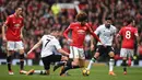 Gelandang Manchester United, Marouane Fellaini dijatuhkan gelandang Liverpool, James Milner pada laga Premier League di Stadion Old Trafford, Manchester, Sabtu (10/3/2018). MU menang 2-1 atas Liverpool. (AFP/Oli Scarff)