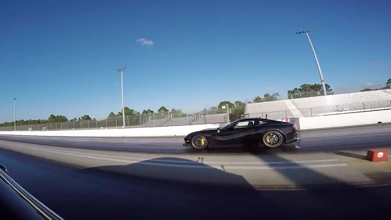 Tesla Lawan Ferrari