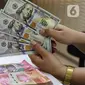 Bank Indonesia (BI) juga menjelaskan, pelemahan nilai tukar rupiah ini sejalan dengan pergerakan mata uang Asia. (Liputan6.com/Angga Yuniar)