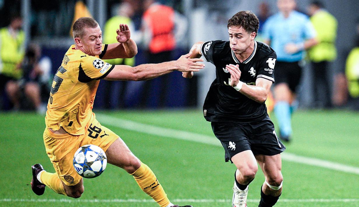 Drama delapan gol menghiasi pertarungan sengit antara Juventus kontra Borussia Dortmund dalam matchday pertama League Phase Liga Champions 2025/2026 di Allianz Stadium, Rabu (17/9/2025) dini hari WIB. Kudua tim harus puas bermain imbang dengan skor 4-4. (Marco Alpozzi/LaPresse via AP)