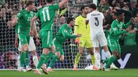 Troy Parrott merayakan golnya pada laga Irlandia melawan Portugal di Kualifikasi Piala Dunia 2026 zona Eropa - AP Photo/Peter Morrison