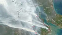 Lewat bidikan kamera MODIS yang disematkan di satelit Terra, NASA memperlihatkan tebalnya kabut asap yang menyelimuti wilayah Riau