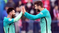 Lionel Messi dan Gerard Pique (AFP/Gerard Julien)