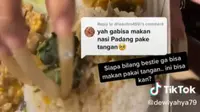 Seorang perempuan makan nasi padang pakai kuku super panjang. (dok. tangkapan layar TikTok @dewiyahya79/https://www.tiktok.com/@dewiyahya79/video/7081920875297033499)