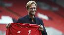 Jurgen Klopp resmi ditunjuk Liverpool sebagai pelatih menggantikan Brendan Rodgers. Pelatih asal Jerman yang pernah sukses bersama Dortmund itu diyakini publik bisa mengangkat prestasi dari The Reds. (AFP/Paul Ellis)
