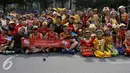 Dalam rangka memperingati Hari Sumpah Pemuda, Gerakan Nasional Orang Tua Asuh (GNOTA) gelar Festival Anak Asuh di Car Free Day, Jakarta, Minggu (1/11/2015). Festival ini diikuti 200 lebih anak asuh dari SDN Kebon Sirih. (Liputan6.com/Yoppy Renato)