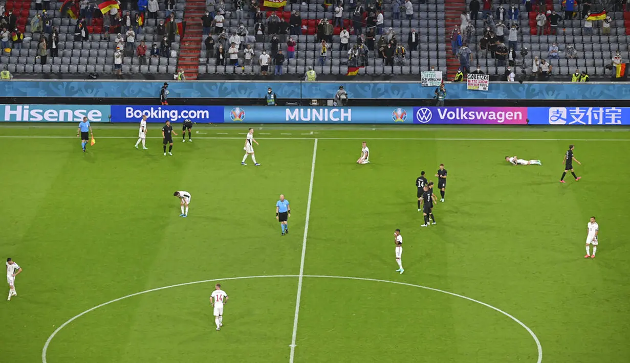 Reaksi para pemain Jerman dan Hungaria usai pertandingan Grup F Euro 2020 di Allianz Arena, Munich, Jerman, Rabu (23/6/2021). Pertandingan berakhir imbang 2-2. Pertandingan berakhir imbang 2-2. (Matthias Hangst/Pool Photo via AP)