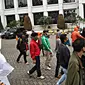 Suporter Persija yang tergabung dalam The Jak Mania berjalan usai melakukan aksi di depan tempat berlangsungnya pengumuman venue final Piala Presiden 2015, Century Park Hotel, Senayan, Jakarta, Rabu (14/10/2015)