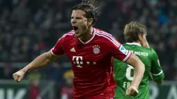 Daniel van Buyten. Bek asal Belgia ini memperkuat Bayern Munchen selama 8 musim mulai 2006/2007 hingga 2013/2014. Gol terakhirnya dicetak di usia 35 tahun dan 10 bulan saat melawan Werder Bremen di ajang Liga Jerman (7/12/2013). (AFP/John MacDougall)