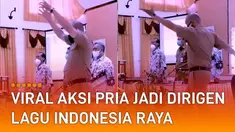 Kedua tangannya diangkat tinggi-tinggi, gerakannya yang menggebu-gebu disorot.