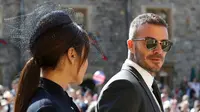 David Beckham dan Victoria Beckham tiba untuk upacara pernikahan Pangeran Harry dan Meghan Markle di St. George's Chapel, Windsor Castle, Windsor, dekat London, Inggris, Sabtu (19/5). (Gareth Fuller/pool photo via AP)