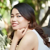 ilustrasi perempuan tersenyum/Dragon Images/Shutterstock