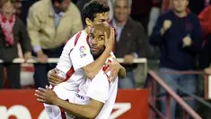Sevilla's Frederic Kanoute celebrates with Jesus Navas after scoring against Valladolid during their Spanish league match at Sanchez Pizjuan stadium in Sevilla, on March 21, 2009. AFP PHOTO/CRISTINA QUICLER