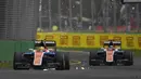 Pembalap F1 tim Manor Racing, Rio Haryanto bersama rekan setimnnya Pascal Wehrlein saat sesi latihan pertama di Australian Formula One Grand Prix di Melbourne (18/3). Dalam latihan tersebut mobil Rio mengeluarkan percikan api. (REUTERS/Jason Reed)