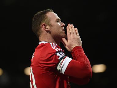 Ekspresi Wayne Rooney setelah Manchester United menang atas Stoke City 3-0 dalam lanjutan Liga Inggris di Stadion Old Trafford, Manchester, Rabu (3/2/2016) dini hari WIB. (AFP/Paul Ellis)