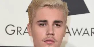  Selebriti yang mendunia,Justin Drew Bieber mantan kekasih dari Selena Gomez ini Nampak hadir di Grammy Award yang digelar di Los Angeles. (AFP/Bintang.com)