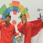 Pesilat Indonesia Hendy dan Yolla Primadona, usai menjuarai pencak silat nomor artistik ganda putra pada Asian Games di TMII, Jakarta, Senin (27/8/2018). Hendy dan Yolla mendapat mendali emas dengan nilai 580. (Merdeka.com/Arie Basuki)