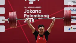 Eko Yuli menambah emas kelima di Asian Games 2018, setelah menjadi juara di kelas 62 kilogram putra dan meraih medali emas dengan total angkatan 311 kilogram. (merdeka.com/Imam Buhori)