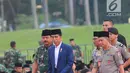 Presiden Joko Widodo bersama Panglima TNI Marsekal Hadi Tjahjanto dan Kapolri Jenderal Tito Karnavian tiba menghadiri buka puasa bersama dengan Keluarga Besar TNI - Polri dan Masyarakat di Lapangan Monas, Jakarta, Kamis (16/5/2019). (Liputan6.com/Angga Yuniar)