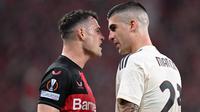 Gelandang Bayer Leverkusen, Granit Xhaka, menorehkan catatan impresif ketika timnya ditahan 2-2 AS Roma pada laga leg kedua semifinal Liga Europa di&nbsp;BayArena, Jumat (10/4/2024) dini hari WIB. (AFP/Kirill KUDRYAVTSEV)