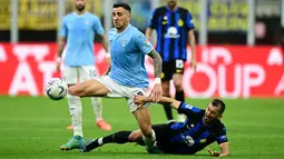 Inter Milan dan Lazio harus berbagi angka usai bermain imbang dengan skor 1-1. (Marco BERTORELLO / AFP)