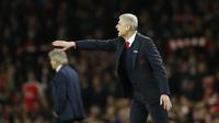 Arsene Wenger mengharapkan para pemain Arsenal mampu mempertahankan momentum positif kala berhadapan melawan Southampton, Minggu (27/12/2015) dini hari WIB. (Reuters/Carl Recine)