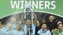 Para pemain Manchester City merayakan gelar juara Piala Liga usai mengalahkan Arsenal di Stadion Wembley, London, Minggu (25/2/2018). City menang 3-0 atas Arsenal. (AFP/Glyn Kirk)