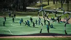 Sejumlah anak bermain Puckelboll di Skarholmen, Stockholm, Swedia, 11 April 2016. Lapangan Puckelboll adalah lapangan sepak bola buatan yang bergelombang dan didesain oleh Johan Storm. (Jonathan NACKSTRAND/AFP)