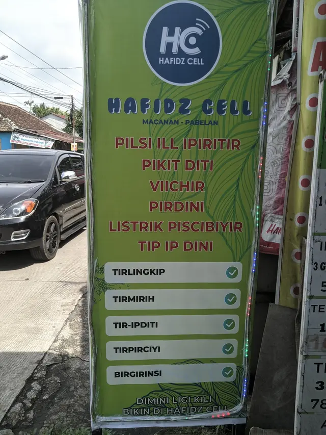 6 Spanduk Jualan Pulsa hingga Service Komputer Huruf Vokalnya I Semua Ini Kocak