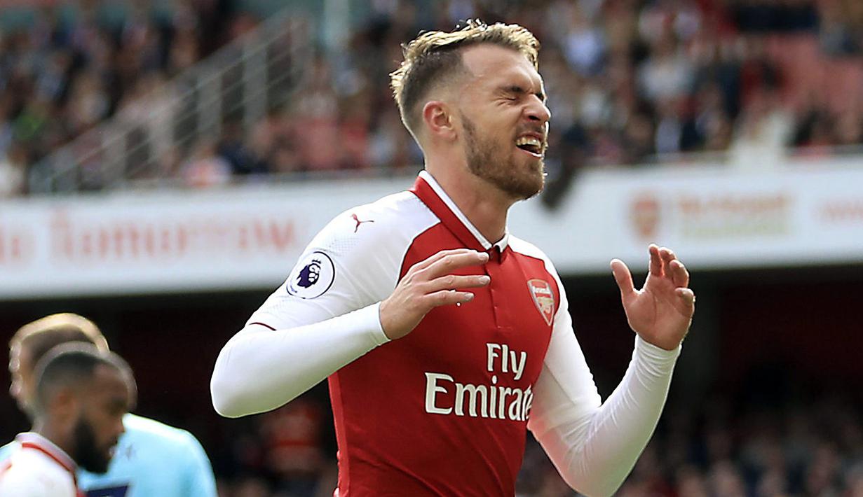 Aaron Ramsey memiliki kelebihan mencetak gol saat penyerang The Gunners kesulitan menerobos pertahanan lawan. Ramsey bisa menjadi solusi Arsene Wagner saat melawan Chelsea pada Derby London. (John Walton/PA via AP)