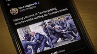 Fake image buatan Artificial Intelligence (AI) yang menunjukkan perlawanan antara Donald Trump dan petugas polisi Kota New York terlihat di iPhone pada 23 Maret 2023. (Foto: AP/J David Ake)
