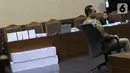 Terdakwa kasus dugaan korupsi terkait pengadaan alat kesehatan di Pemprov Banten dan Pemkot Tangerang Selatan serta Tindak Pidana Pencucian Uang, Tubagus Chaeri Wardana saat menjalani sidang pembacaan dakwaan di Pengadilan Tipikor, Jakarta, Kamis (31/10/2019). (Liputan6.com/Helmi Fithriansyah)