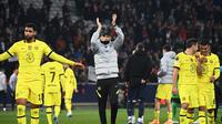 Manajer Chelsea Thomas Tuchel merayakan kemenangan 2-1 atas Lille pada leg kedua babak 16 besar Liga Champions di Stadion Pierre Mauroy. Kamis (17/3/2022) dini hari WIB. (FRANCK FIFE / AFP)
